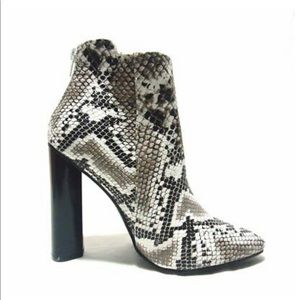 Snake skin heeled boots